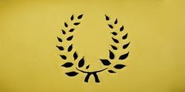 a wreth of olive leaves cut out on a slice of dutch cheese